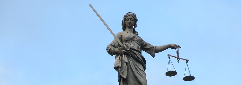 "Justice isn't blind, she carries a big stick" by Jason Rosenberg on Flickr